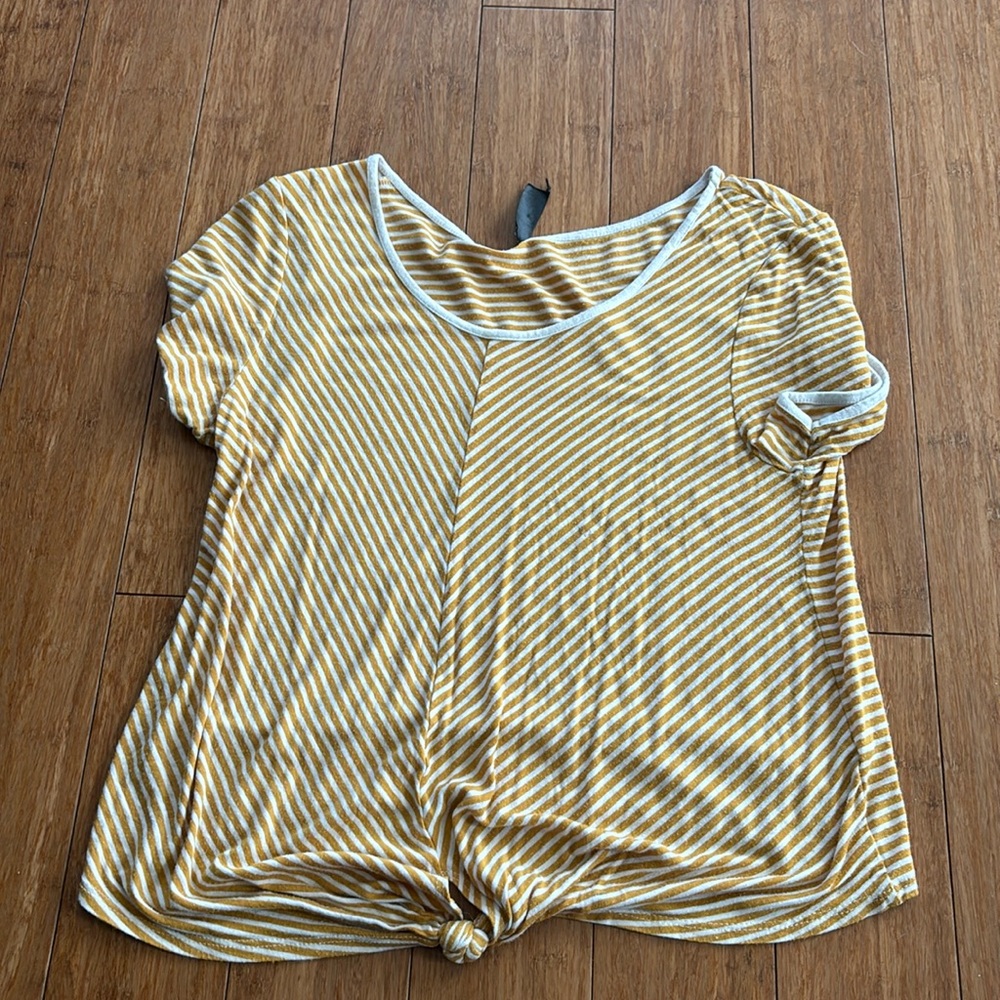 This is a yellow and white stripped fornia kids medium t-shirt